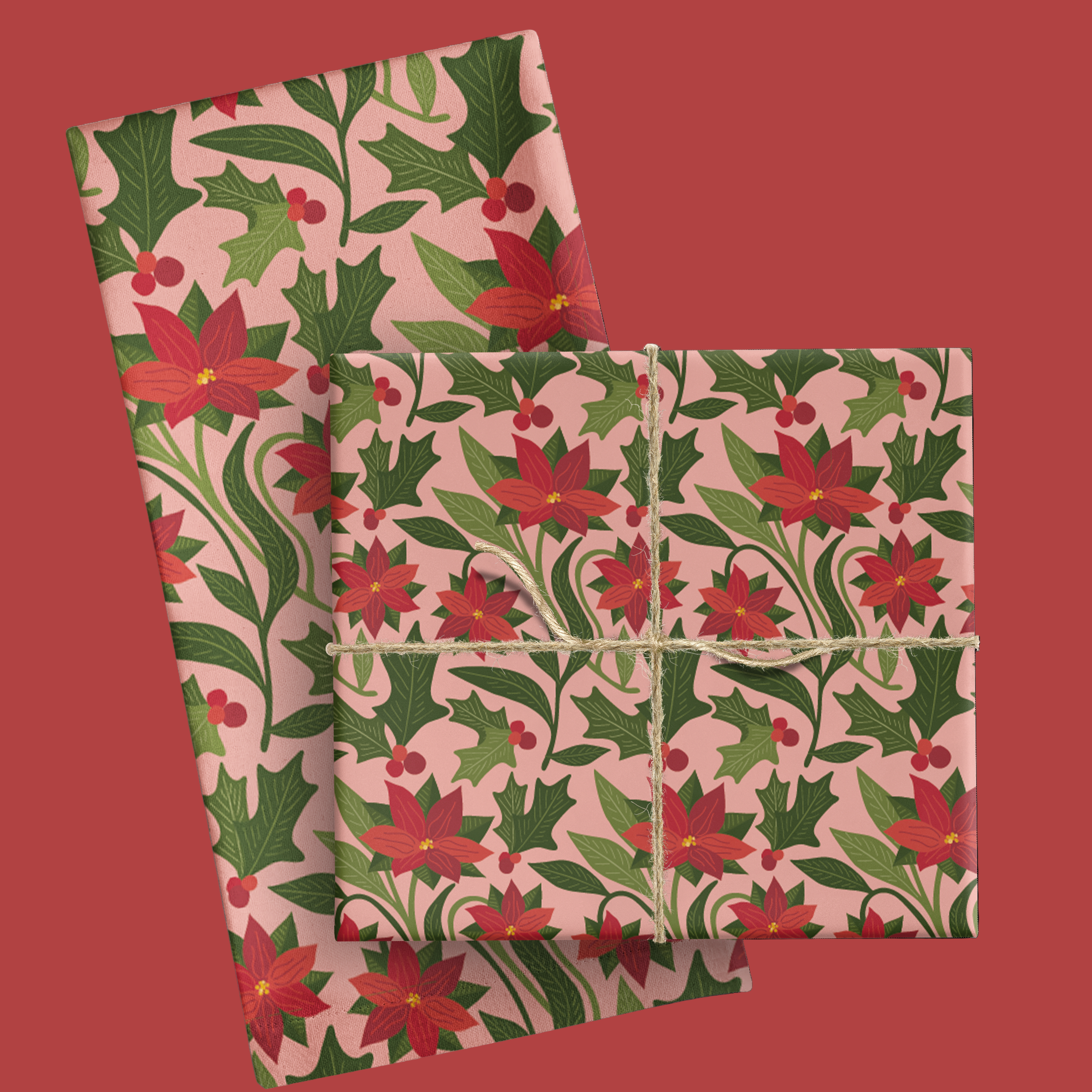 Floral patterned tea towel with pionsettia and green leaves on a pink background